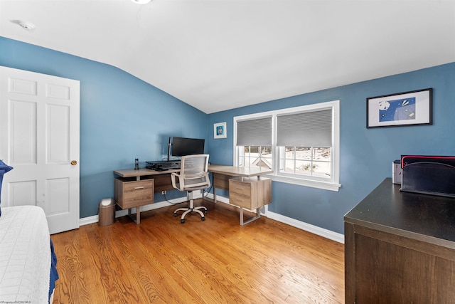 office area with hardwood / wood-style floors and vaulted ceiling