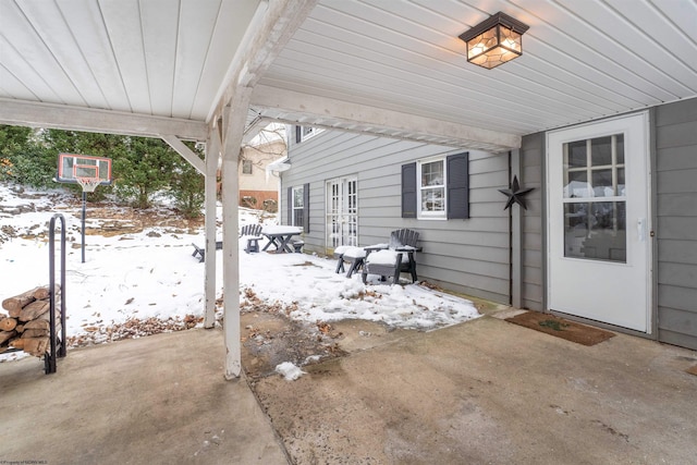 view of snow covered patio