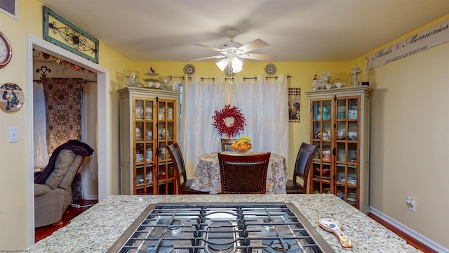 dining space featuring ceiling fan