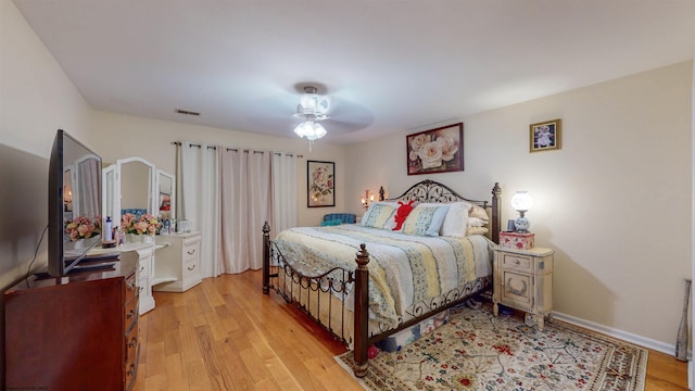 bedroom featuring light wood-type flooring and ceiling fan