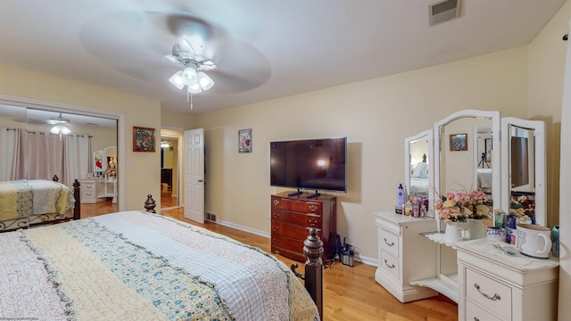 bedroom featuring ceiling fan, light hardwood / wood-style flooring, and a closet