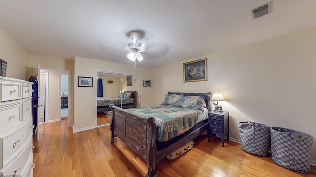 bedroom with ceiling fan and hardwood / wood-style flooring