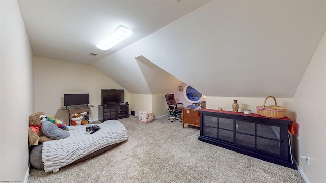 bedroom featuring carpet floors and vaulted ceiling