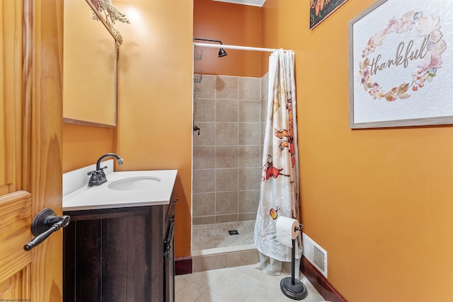 bathroom with tile patterned flooring, vanity, and a shower with shower curtain