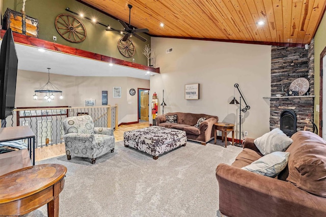 living room with carpet, high vaulted ceiling, ceiling fan with notable chandelier, and wooden ceiling