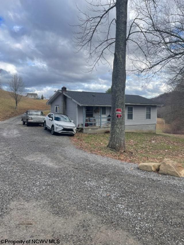 single story home featuring covered porch