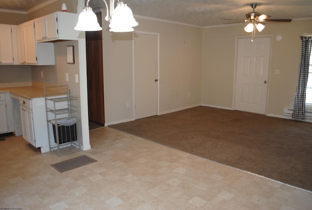 9412 Morgantown Pike, Philippi, WV 26416 - kitchen with ceiling fan with notable chandelier, light colored carpet, light countertops, and ornamental molding