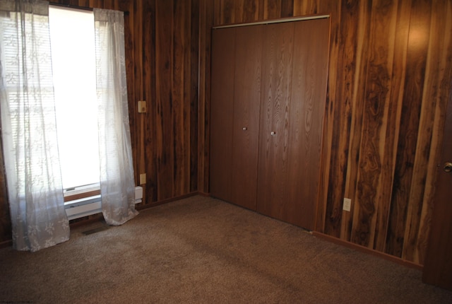 9412 Morgantown Pike, Philippi, WV 26416 - unfurnished bedroom with a closet, wooden walls, and carpet