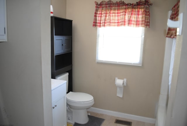 9412 Morgantown Pike, Philippi, WV 26416 - bathroom with toilet, vanity, baseboards, and visible vents