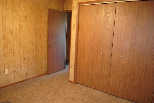 9412 Morgantown Pike, Philippi, WV 26416 - unfurnished bedroom featuring a closet, baseboards, carpet floors, and wood walls