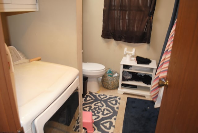 9412 Morgantown Pike, Philippi, WV 26416 - bathroom with toilet and washing machine and clothes dryer