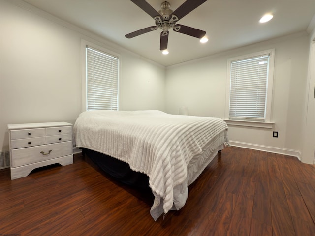 bedroom featuring ceiling fan, dark hardwood / wood-style flooring, and ornamental molding