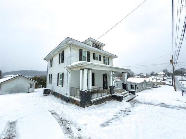 view of front of home featuring covered porch and central AC