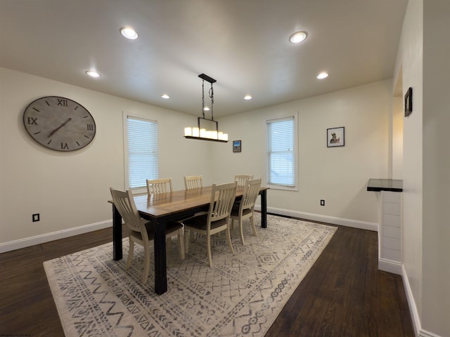 dining space with dark hardwood / wood-style floors