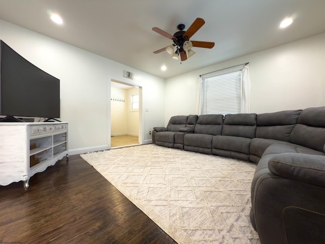 living room with ceiling fan and wood-type flooring