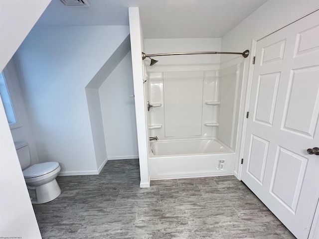 bathroom with toilet and shower / washtub combination