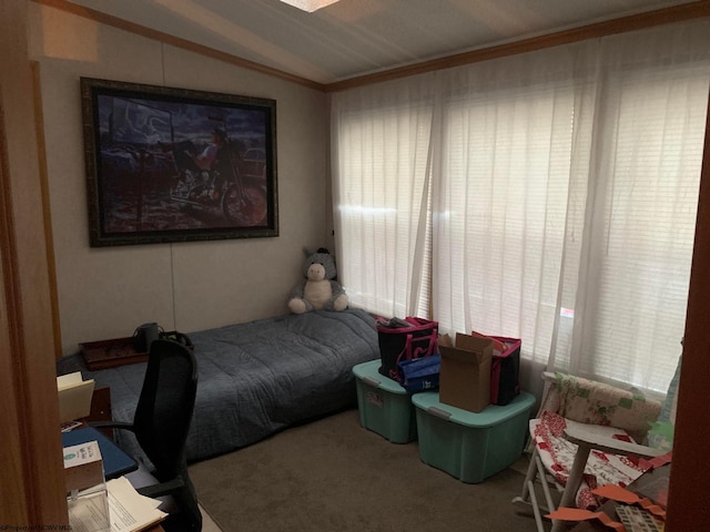 carpeted bedroom with lofted ceiling