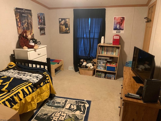 bedroom with carpet floors and ornamental molding