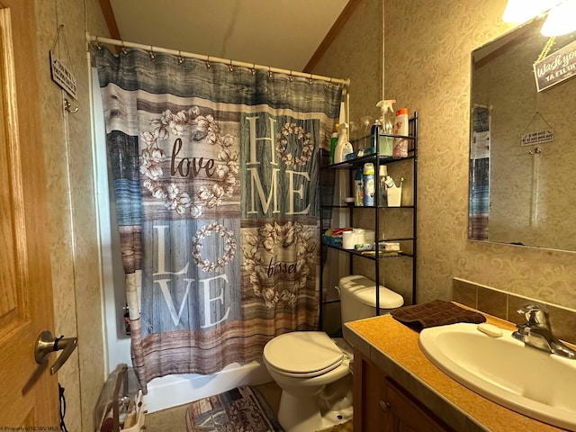 full bathroom with toilet, tasteful backsplash, shower / bath combination with curtain, vaulted ceiling, and vanity