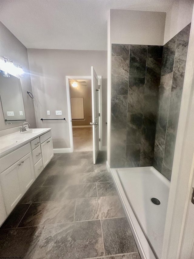 bathroom featuring vanity and a shower