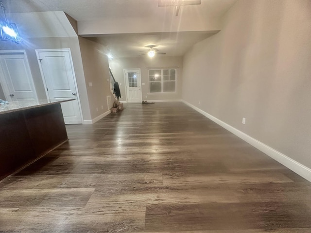 unfurnished living room with dark hardwood / wood-style flooring