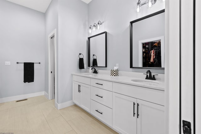 bathroom featuring vanity and tile patterned flooring