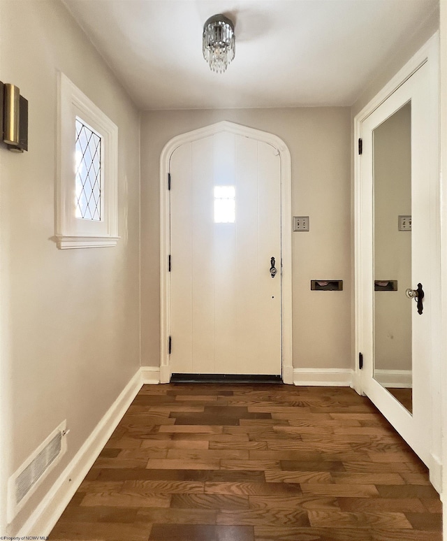 doorway to outside with dark hardwood / wood-style flooring