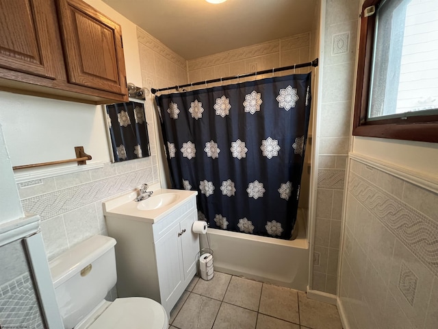 full bathroom featuring tile walls, tile patterned floors, vanity, and shower / bath combo