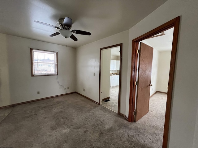 empty room with light carpet and ceiling fan