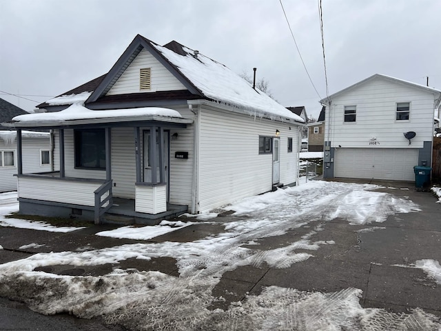 view of front of house with a garage and covered porch