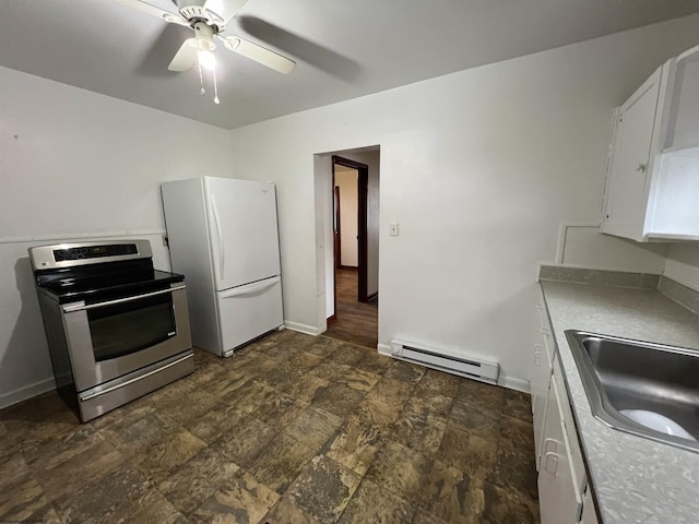 kitchen with a baseboard radiator, white cabinets, white refrigerator, sink, and stainless steel range with electric stovetop