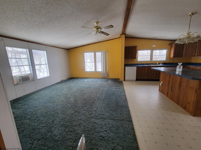 kitchen featuring ceiling fan with notable chandelier, a wealth of natural light, dishwasher, decorative light fixtures, and lofted ceiling with beams