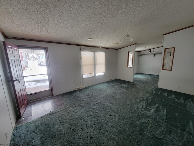 carpeted empty room featuring a textured ceiling and ornamental molding