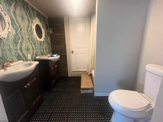 bathroom featuring toilet and vanity