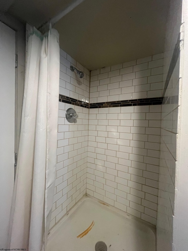 bathroom with a shower with curtain