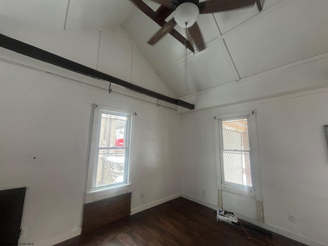 empty room featuring high vaulted ceiling, dark wood-type flooring, and ceiling fan