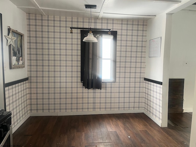 unfurnished dining area featuring dark wood-type flooring