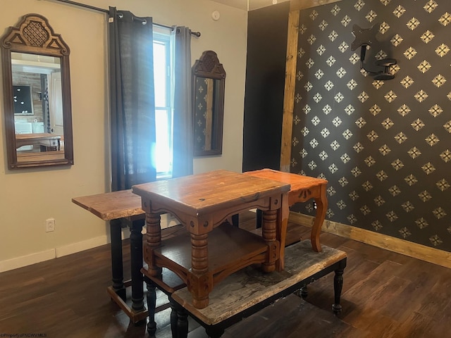 dining area featuring dark wood-type flooring