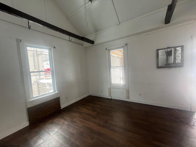 unfurnished room featuring dark wood-type flooring and vaulted ceiling