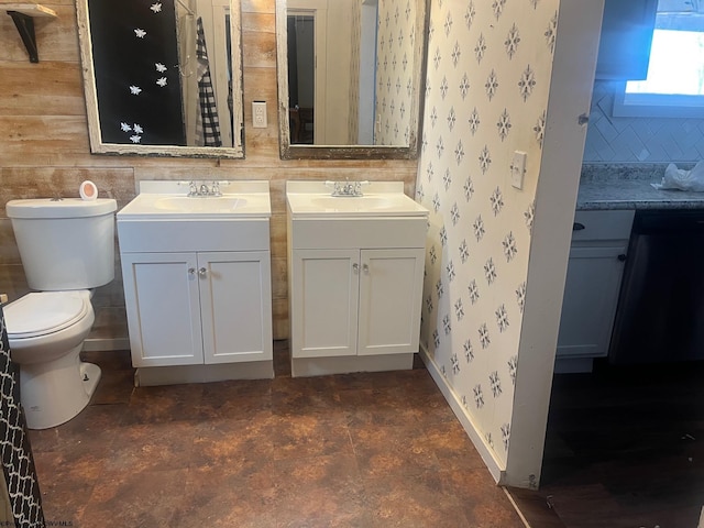 bathroom with toilet and vanity