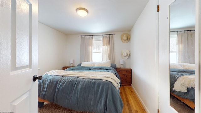 bedroom with light wood-type flooring