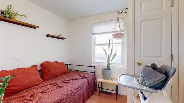 bedroom with light wood-type flooring