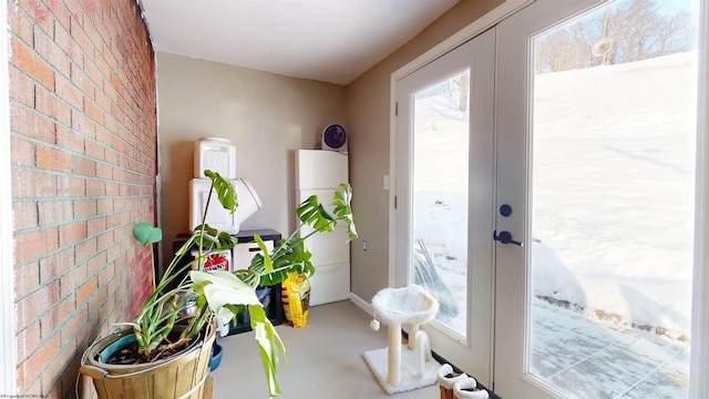 doorway with concrete floors and french doors