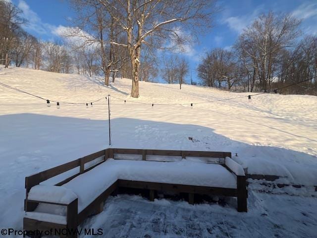 view of yard layered in snow