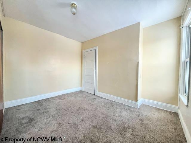 empty room with carpet flooring