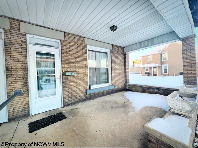 property entrance featuring a patio