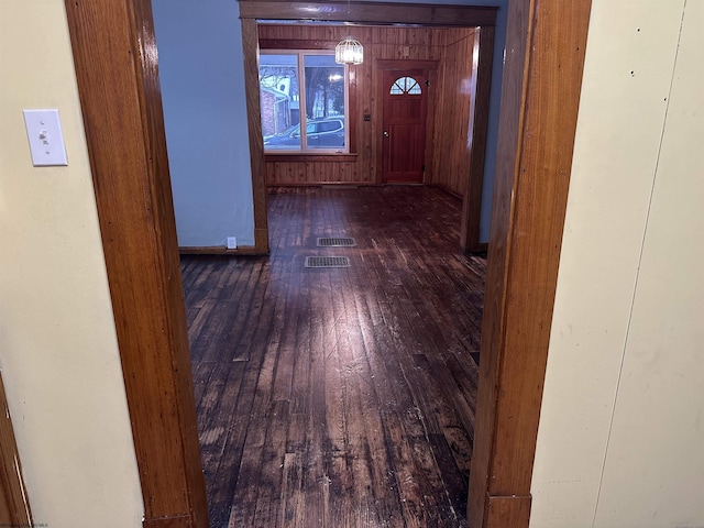 corridor with dark wood-type flooring