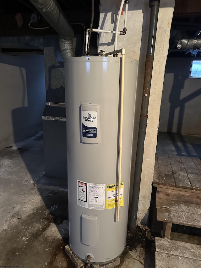 utility room featuring water heater