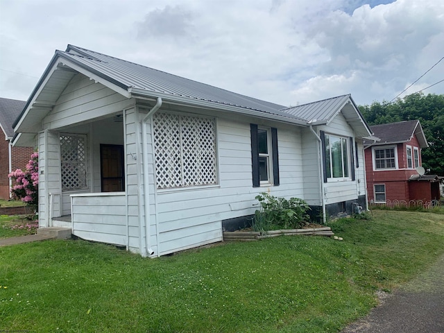 view of home's exterior featuring a yard