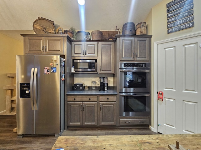 kitchen featuring dark hardwood / wood-style floors and stainless steel appliances